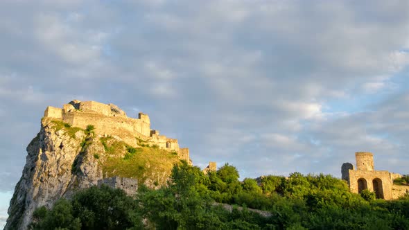 Sunrise Couds Sky over Historic Castle Ruins in Green Forest