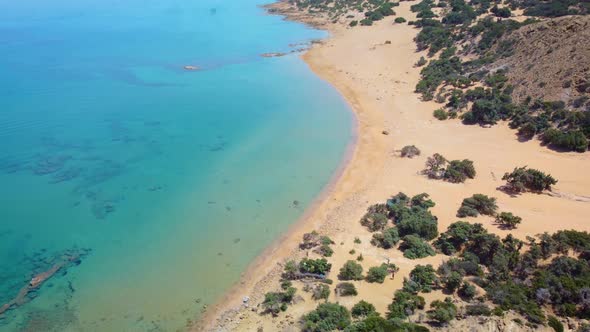 A sunny day on the beautiful Gavdos island, Agios Ioannis beach, Greece. Aerial