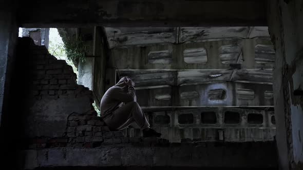 Social Problems In People. Sad Man In An Abandoned Building, Depressed Man Cinematic Tone.