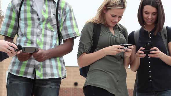 High school students using smartphones