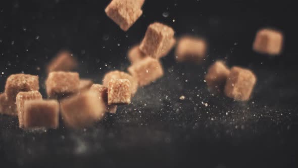 Super Slow Motion Drop Pieces of Cane Sugar