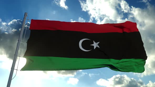 Libya National Flag Waving Wind Blue Sky Background