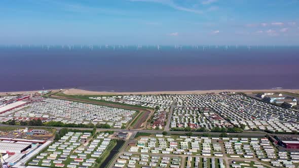 Aerial footage of the beach front at Skegness Ingoldmells showing caravans