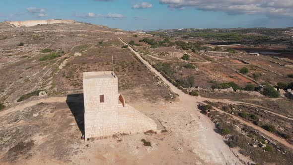 Aerial drone video from northern Malta near the Ghajn Znuber Tower.