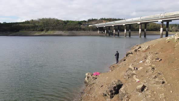 Young Man Fishing Lake