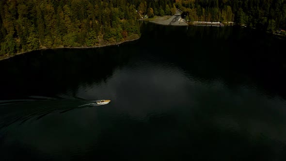 Aerial Shot of Beautiful Alpine Lake Ritsa Speed Boat Floating Summer, View From Above on Gorgeous