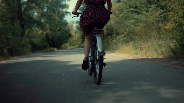 Cyclist Travel Woman On Bicycle. Hair Blowing Girl Cycling. Cyclist Girl In Dress Workout.