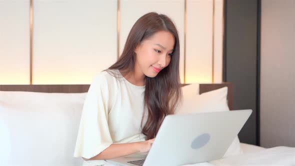 Young asian woman use laptop