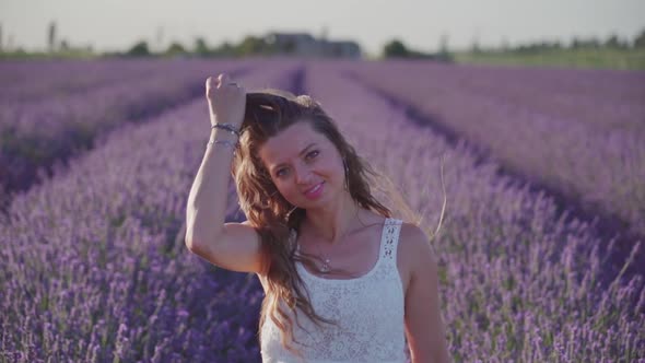 Beautiful Young Girl Touches Her Hair in Slow Motion