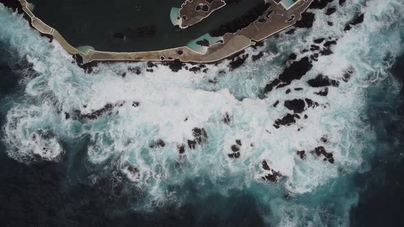A top down view of the crashing waves in Madeira. Shot on DJI.