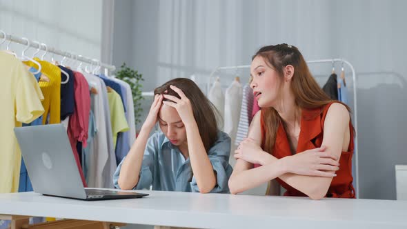 Asian beautiful businesswoman feel frustrated after check sale order.