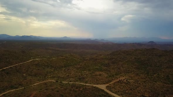 Aerial drone shot of the Arizona mountains and landscape on a cloudy day.