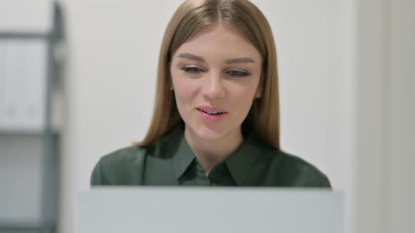 Woman Doing Video Chat on Laptop