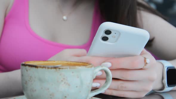 Girls' Hands Write an Online Message on Their Smartphone