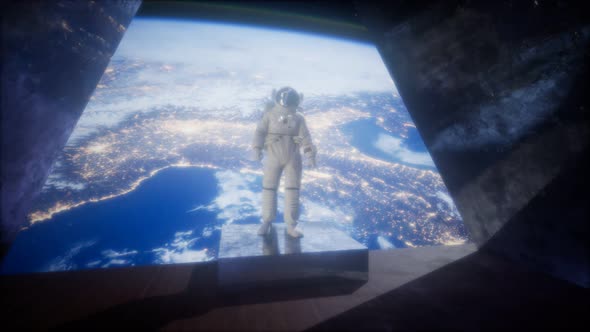 Astronaut on the Space Observatory Station Near Earth alt
