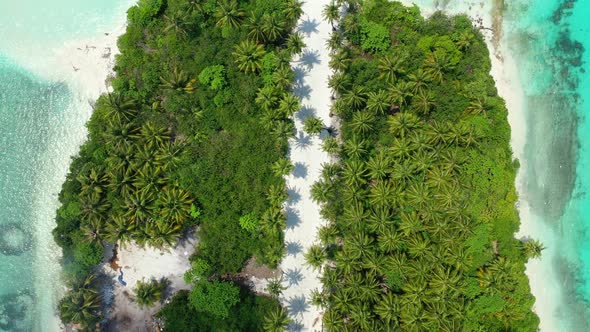 Natural fly over abstract shot of a white sand paradise beach and aqua blue water background in vibr