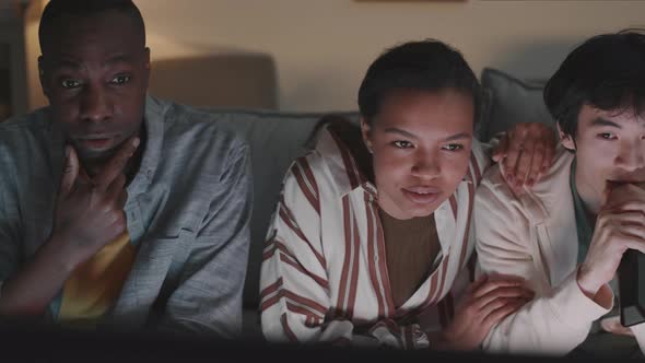 Diverse Friends Watching Movie at Home