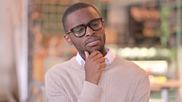 Portrait of Pensive African Man Thinking About Something 