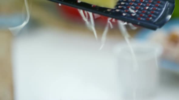 Grating Cheese on Hot Pasta