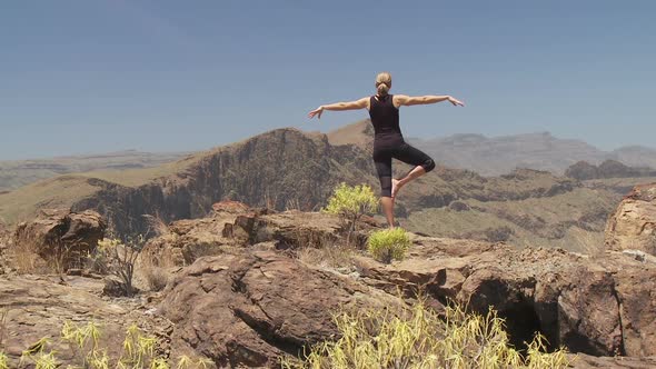 Yoga on Rocks in Canyon