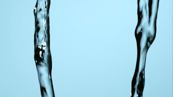 Water pouring and splashing in ultra slow motion 1500fps on a reflective surface - WATER POURS