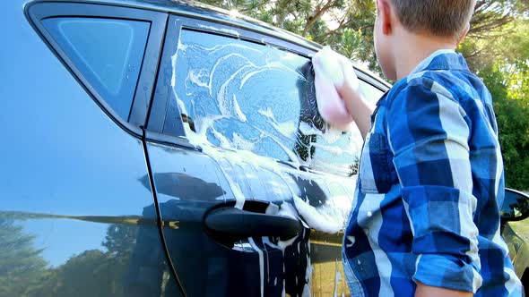 Boy washing a car 4k