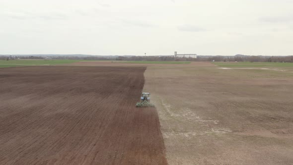 Tractor Plowing Soil Ffr a New Farming Season