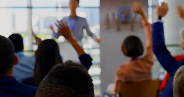 Business people raising their hands in the business seminar 4k