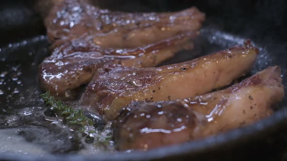 Onions are Thrown to the Сastiron Pan Fried in Butter