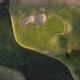 top view down shot of people playing at Golf Club José Jurado at sunset in Buenos Aires city - VideoHive Item for Sale