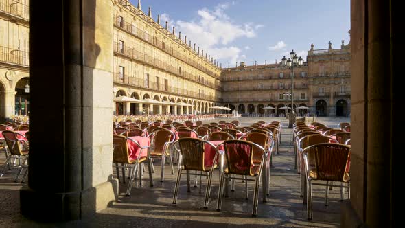 Walking the Cafe with Pink Tables and Wicker Chairs at Plaza Mayor in Salamanca, Spain. Salamanca Is