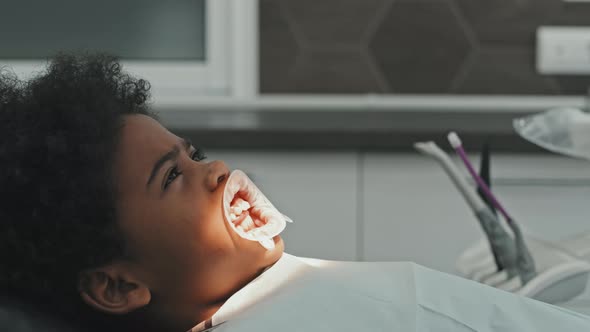 Black Boy Waiting for Dental Procedure