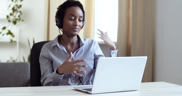 Successful Afro American Girl Business Woman Manager Operator Assistant Wears Head Microphone