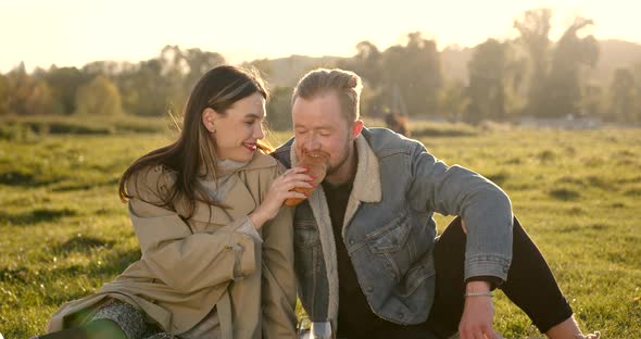 Young Man and a Woman Having a Picnic