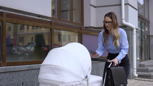 Overloaded Business Mother Talking Phone and Swinging Infant Carriage, Balance