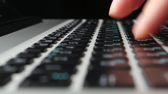 Hands of an Office Worker Typing on Keyboard, Close Up, Cam Moves To the Right, Side View, Black