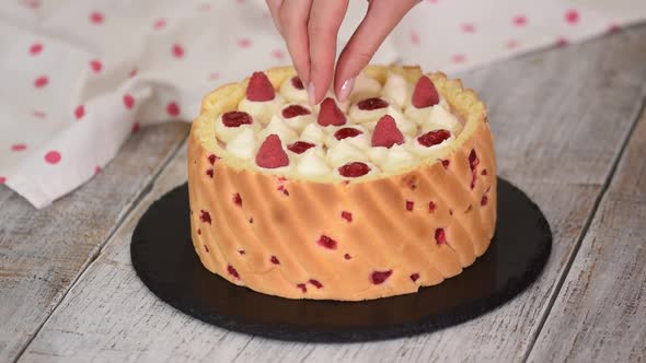 Chef Decorating Mousse Cake with Berry