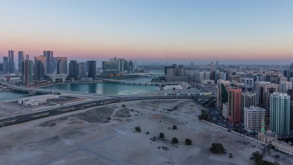 Aerial Skyline of Abu Dhabi City Centre From Above Day to Night Timelapse