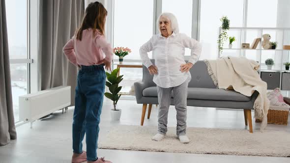Grandmother and Granddaughter Exercising