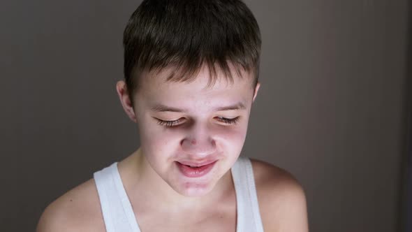 Closeup of a Face Profile of Talking Smiling Teenager Looking Down