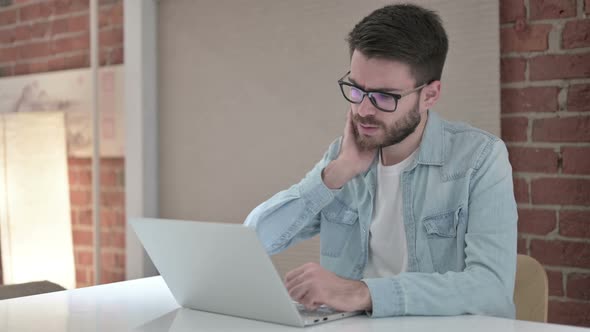 Tired Young Male Designer Having Neck Pain