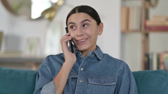 Latin Woman Talking on Smartphone