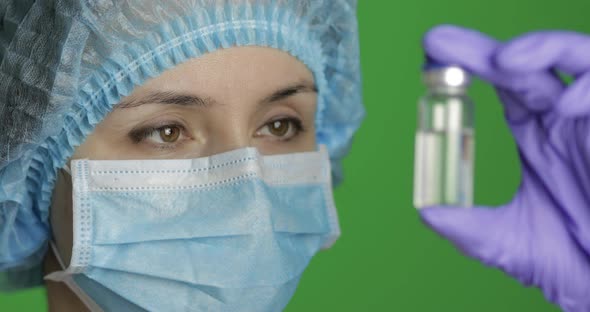 Female Scientist Holding Ampoule in Hand, New Medication Developing, Vaccination