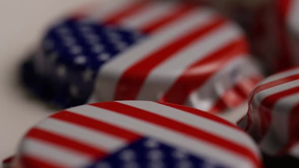 Rotating shot of bottle caps with the American flag printed on them - BOTTLE CAPS 044