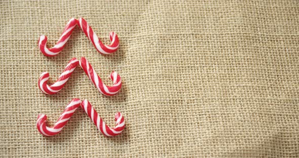 Candy cane arranged on textile 4k