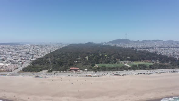 Super wide aerial panning shot of Golden Gate Park from the Pacific Ocean in San Francisco. 4K