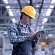 Worker Male Warehouse Worker Engineer Man in a Helmet Working on the Construction Site of the - VideoHive Item for Sale