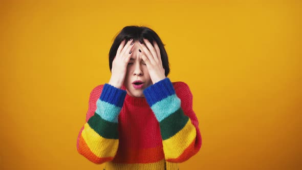 Studio Portrait of Young Shocked Woman Looking at Camera Feeling Amazed and Stunned Orange