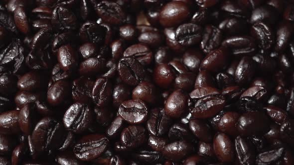 Top View Shot of Heap of Dark Color of Raw Coffee Beans Texture for Background