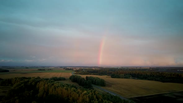 Dark Thunderstorm Clouds and Double Rainbow Over Forest and Wheat Field, Areal Dron Shoot.